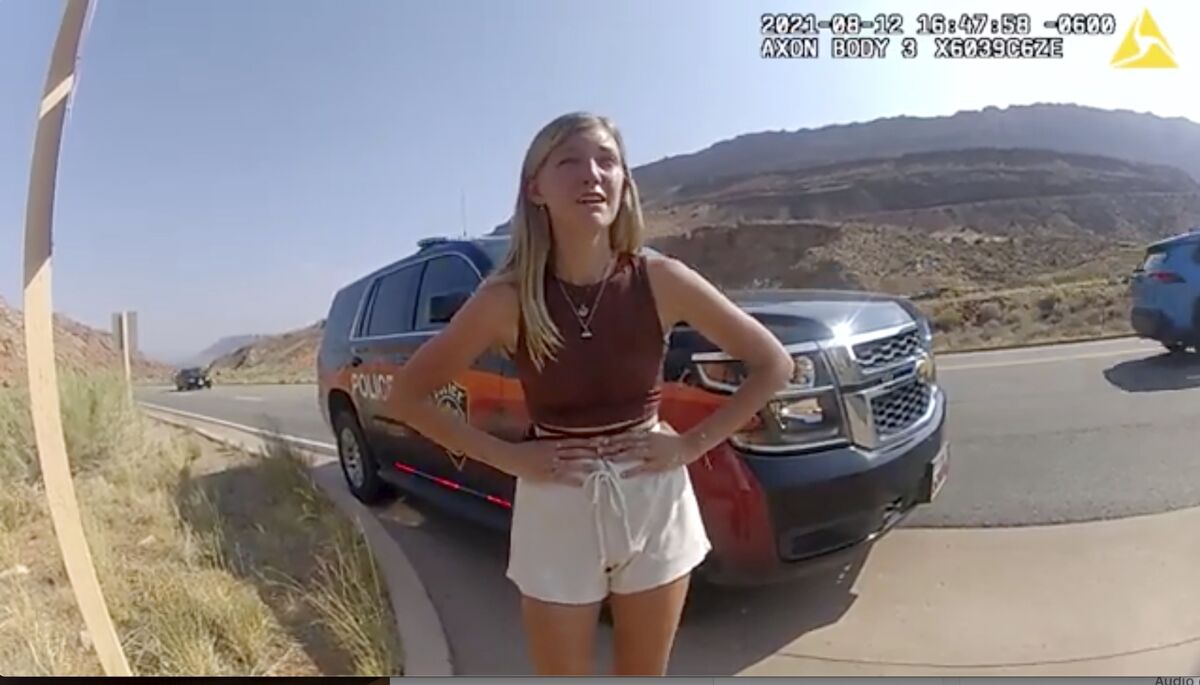  Gabrielle "Gabby" Petito, hands on hips, is seen in a roadside video image.
