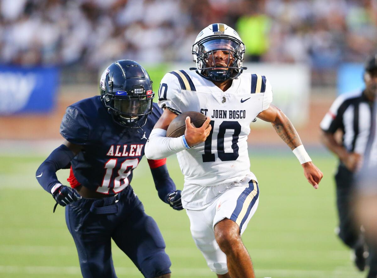 St. John Bosco quarterback Pierce Clarkson breaks into the secondary ahead of Allen defender Taylor Collins.