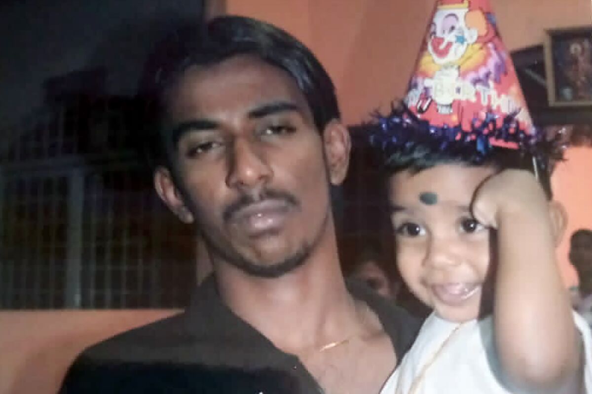 This undated photo provided by Sarmila Dharmalingam shows her younger brother Nagaenthran K.Dharmalingam holding his nephew in Ipoh, Malaysia. Singapore is due to hang the Malaysian man next week for smuggling a small amount of heroin into the country, but legal and human rights groups are urging the execution be halted because the man is intellectually disabled. (Courtesy of Sarmila Dharmalingam via AP)
