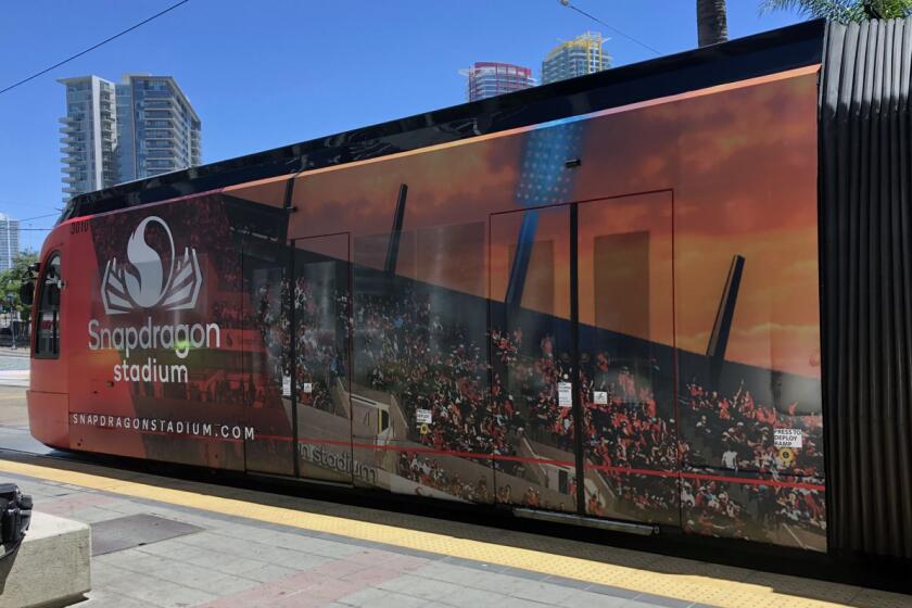 An image of Snapdragon Stadium is included on SDSU-themed trolley wraps.