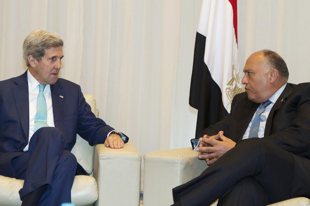 Secretary of State John Kerry, left, and Egyptian Foreign Minister Sameh Shukri meet at an economic conference in Sharm el-Sheikh, Egypt, on Sunday.