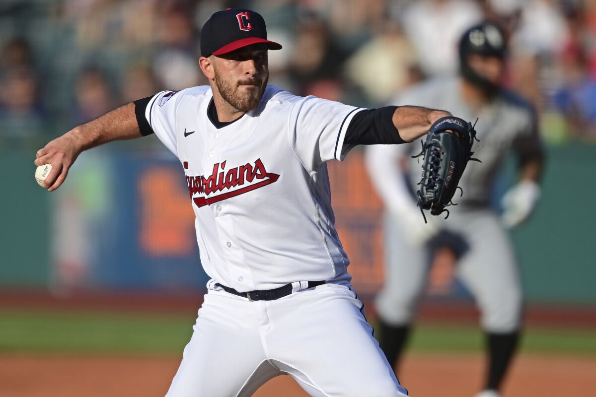 Cleveland Guardians starting pitcher Aaron Civale delivers during the first inning of the team's baseball game against the Chicago White Sox, Wednesday, July 13, 2022, in Cleveland. (AP Photo/David Dermer)