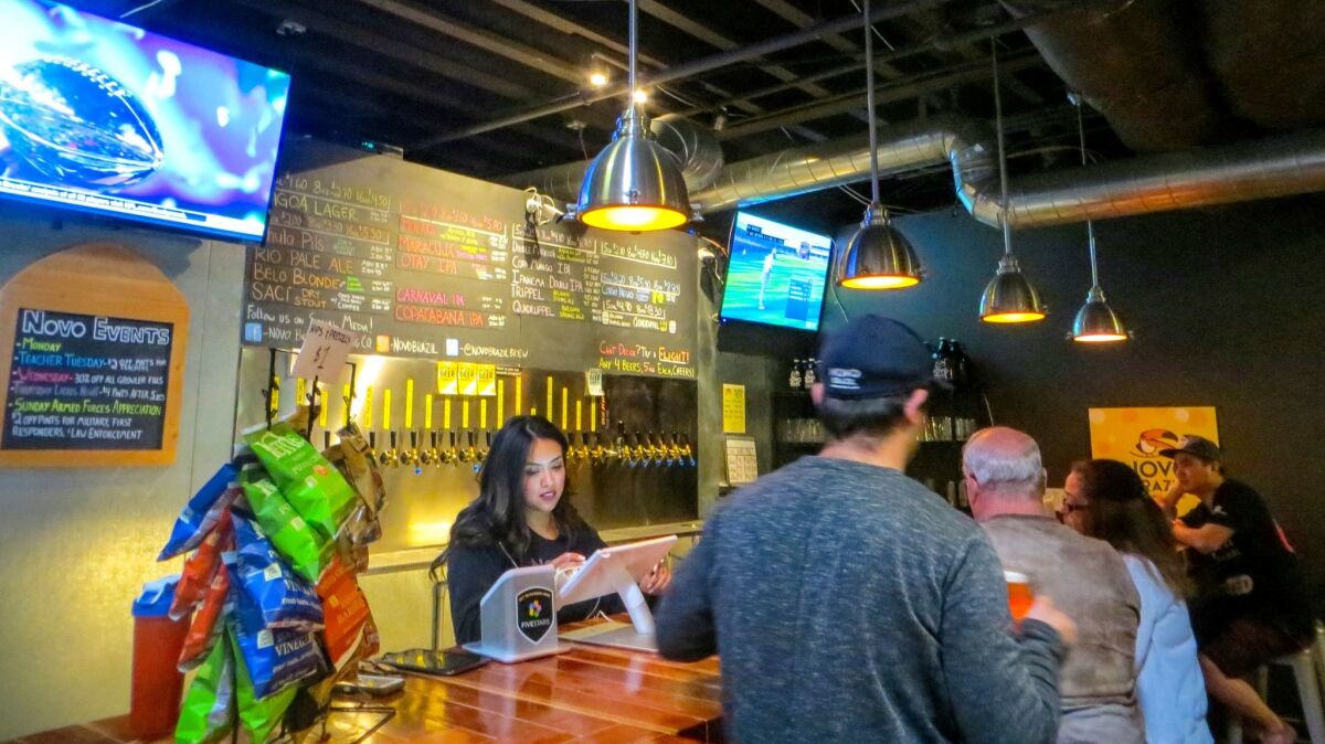 Bellying up to the bar at Novo Brazil Brewing in Chula Vista. (Irene Lechowitzky)