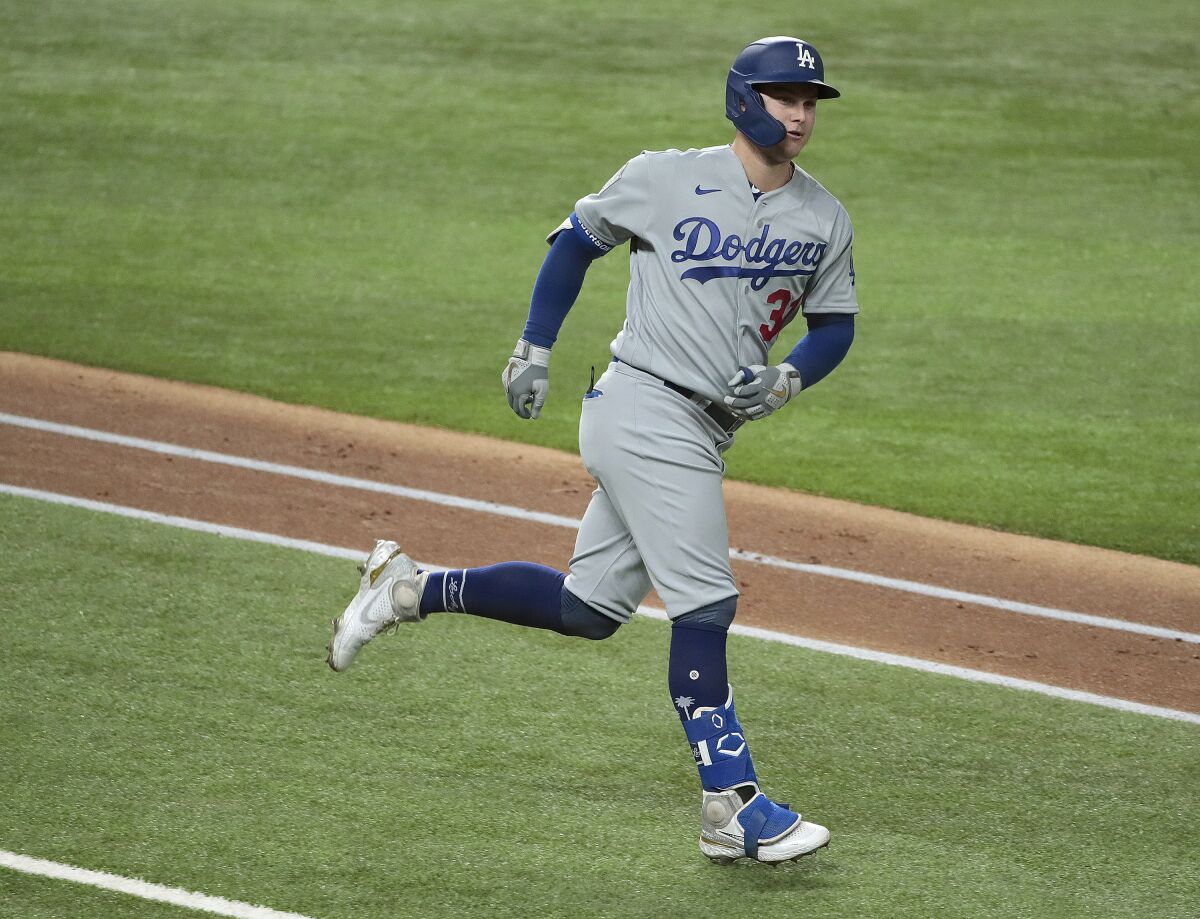 Dodgers left fielder Joc Pederson rounds the bases after a home run in the 2020 World Series.