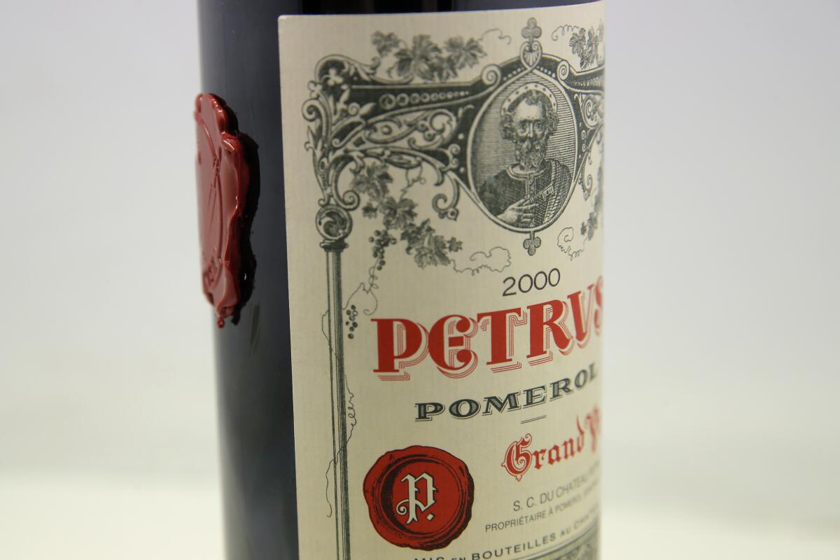 A bottle of Petrus red wine that spent a year orbiting the world in the International Space Station is pictured in Paris Monday, May 3, 2021. The bottle of French wine is up for a private sale at Christie’s, with a stratospheric price tag in the region of euro 1 million. (AP Photo/Christophe Ena)