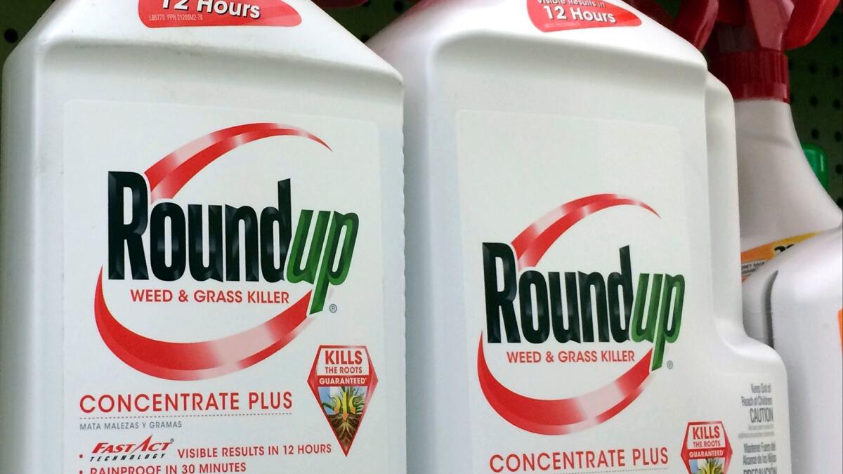 A federal judge on Monday temporarily halted a requirement to post a Proposition 65 cancer warning on products that contain traces of glyphosate, a chemical in Monsanto's trademarked herbicide Roundup, shown here on a Los Angeles-area hardware store shelf in January.