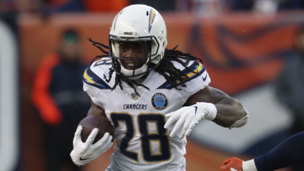 Chargers running back Melvin Gordon rushes during the second half against the Denver Broncos in Denver.