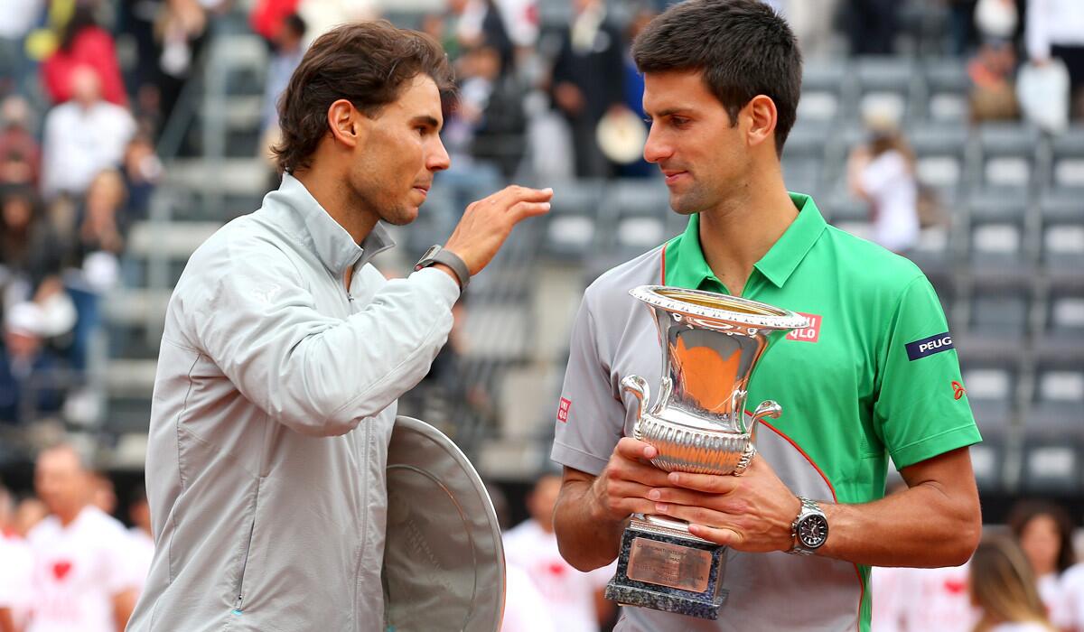 Runner-up Rafael Nadal congratulates Novak Djokovic after he was presented with the winner's trophy at the Italian Open on Sunday in Rome.