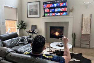 Eric Vieira checks out the streaming options on his smart TV.