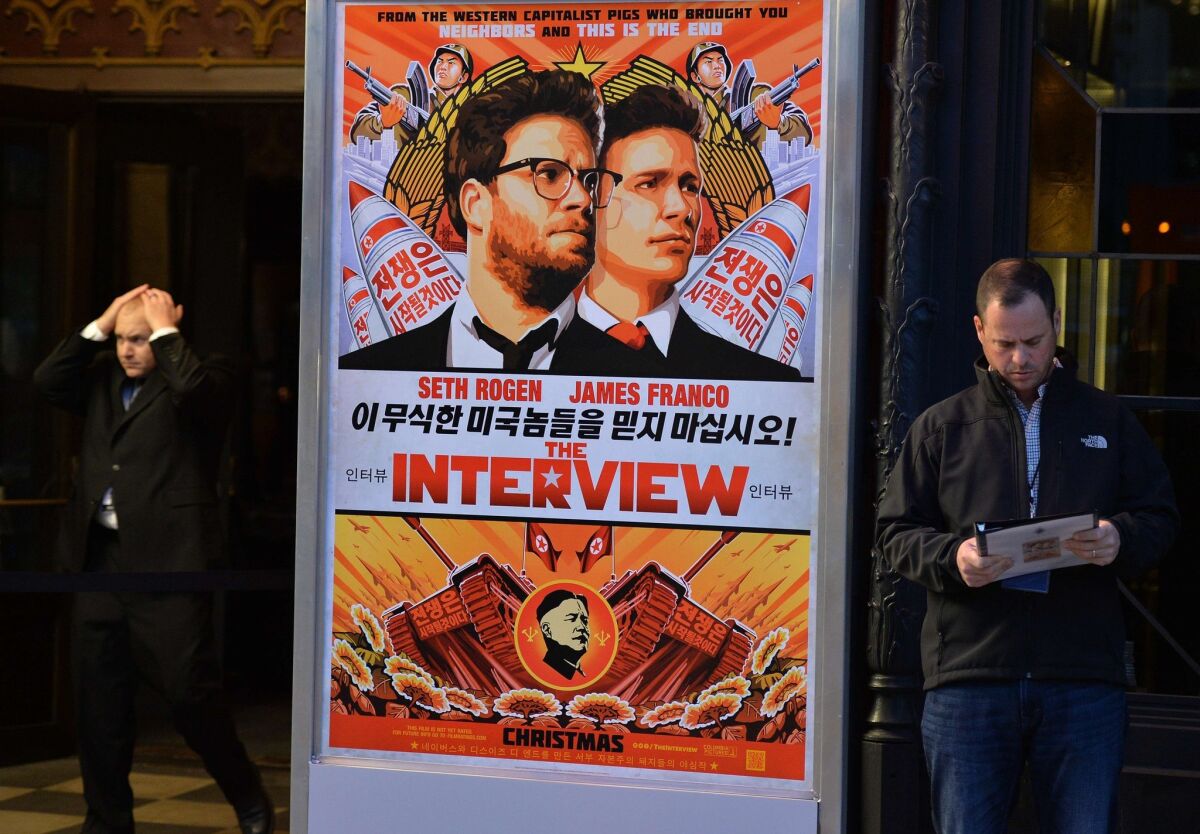 Security is seen outside The Theatre at Ace Hotel before the premiere of the film "The Interview." On Wednesday, Sony Pictures canceled the December 25 release date of the film after threats from anonymous hackers.