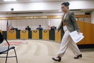 Santa Ana, CA - June 13: Robin Gurien walks back to her seat after speaking during a board meeting at the Santa Ana Unified School District Board Room on Tuesday, June 13, 2023 in Santa Ana, CA. Two recently approved ethnic studies classes have been at the center of renewed controversy as they prepare lessons on the Israeli-Palestinian conflict. Pro-Israel groups criticize the classes for presenting a one-sided view of Jews and the Middle Eastern nation. Pro-Palestinian advocates support the classes for what they view as a fair and accurate treatment of the conflict. The district continues meeting with all sides but has not announced any changes to the proposed classes. (Dania Maxwell / Los Angeles Times).
