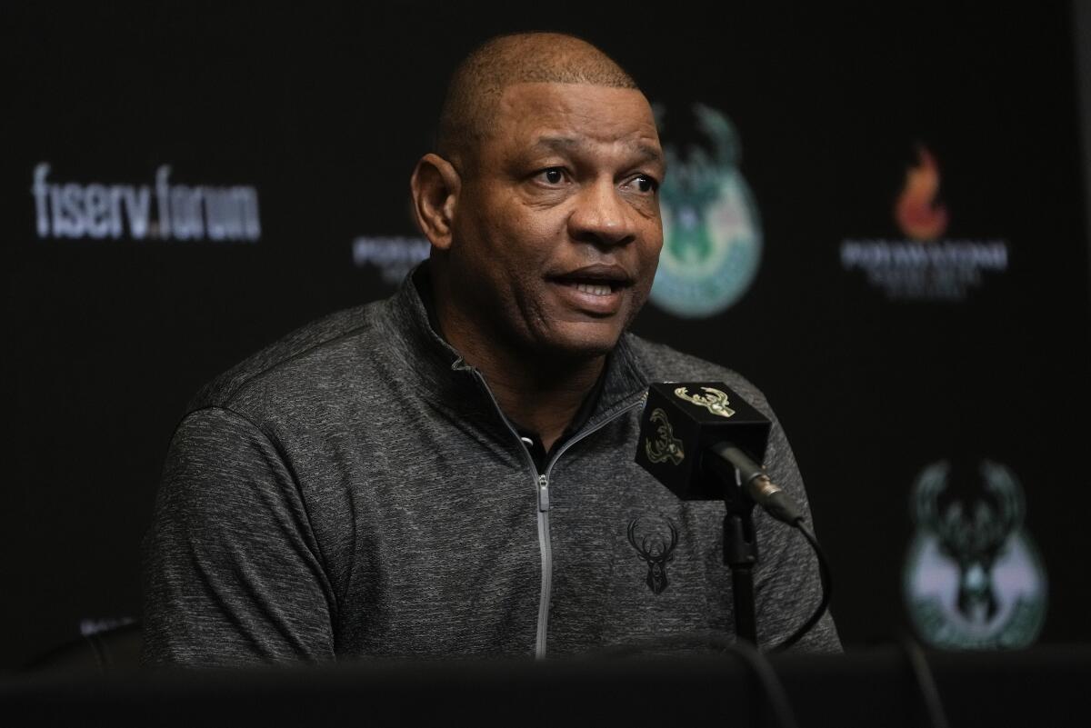 Doc Rivers speaks at a microphone