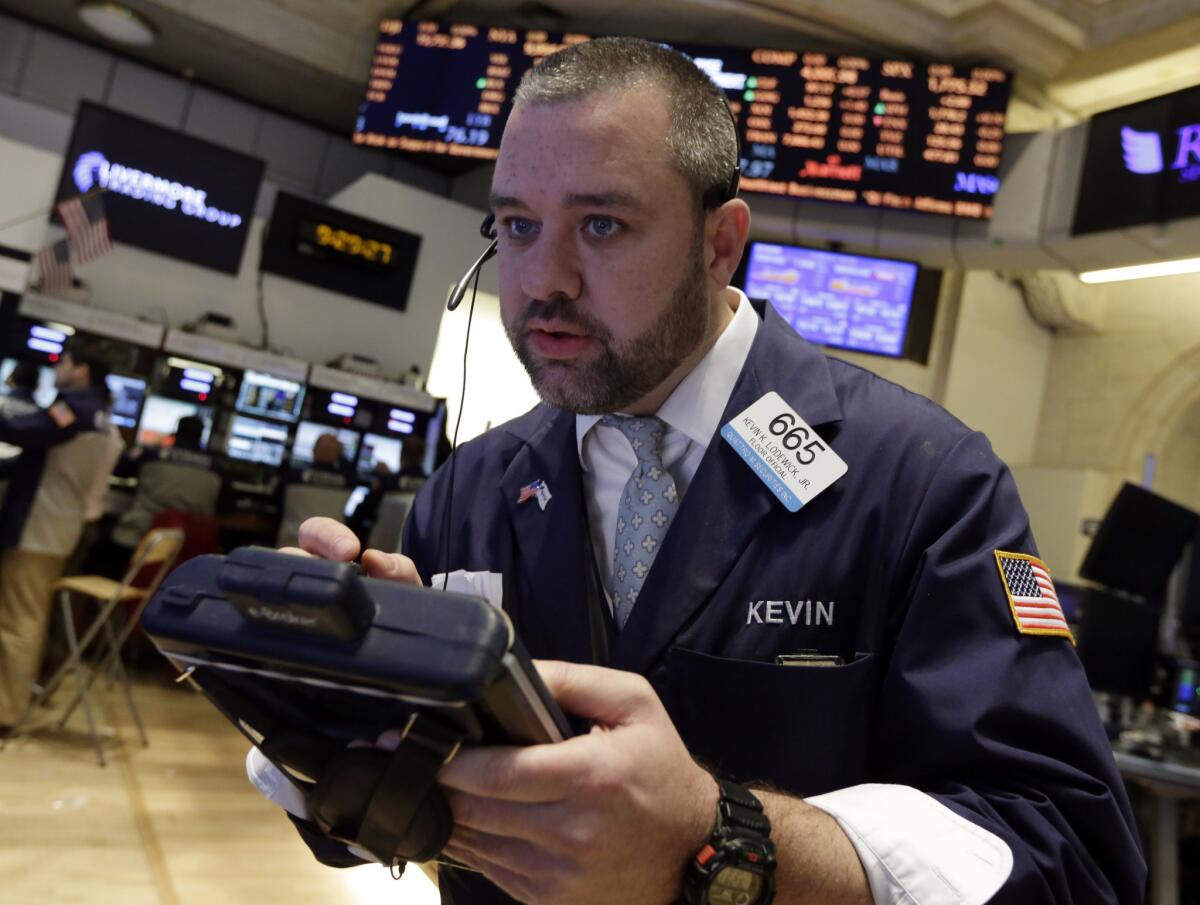 Trader Kevin Lodewick works on the floor of the New York Stock Exchange.