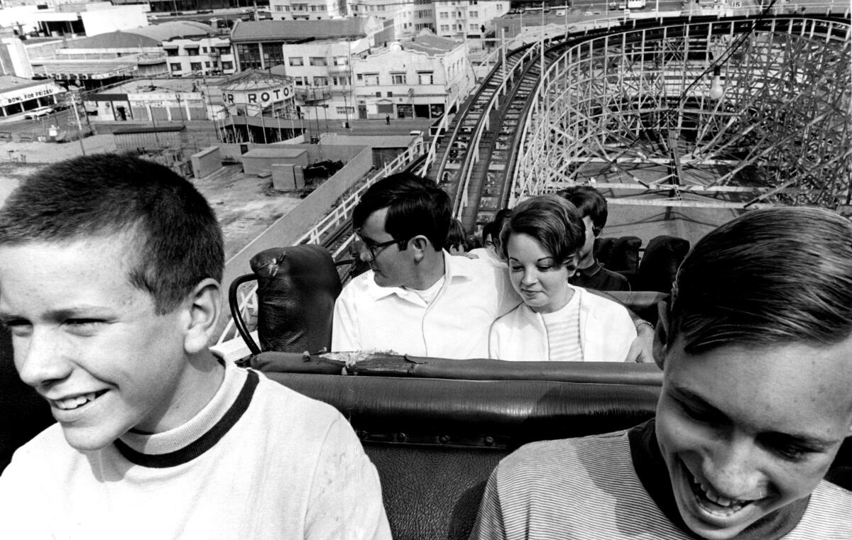 Thrill-seekers enjoy a final ride on the Cyclone Racer on its last day of operation, Sept. 15, 1968. The ride was later torn down.