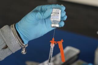 A Jackson-Hinds Comprehensive Health Center nurse loads a syringe with a Moderna COVID-19 booster vaccine at an inoculation station next to Jackson State University in Jackson, Miss., Friday, Nov. 18, 2022. Moderna recently announced early evidence that its updated booster induced BQ.1.1-neutralizing antibodies. (AP Photo/Rogelio V. Solis)