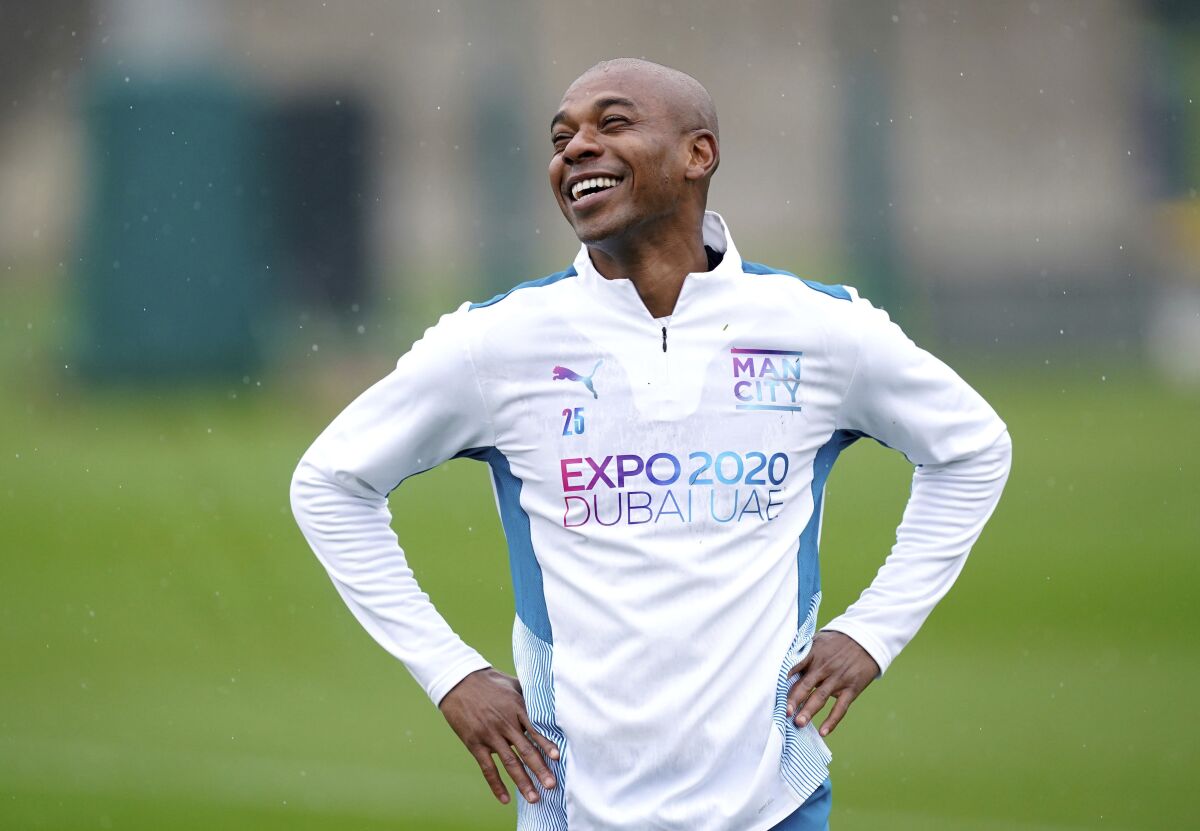 Manchester City's Fernandinho smiles during a training session ahead of Wednesday's Champions League match against Atletico Madrid, at the City Football Academy, Manchester, England, Tuesday April 12, 2022. (Martin Rickett/PA via AP)