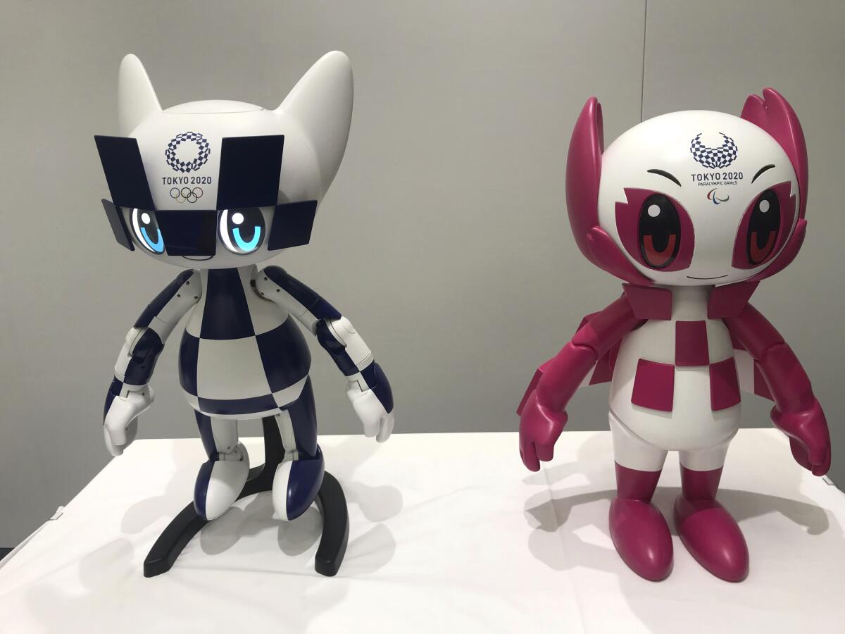 Robots of Tokyo 2020 Olympics mascots Miraitowa, left, and Someity are shown to the media Thursday at Toyota Motor Corp. headquarters in Tokyo.