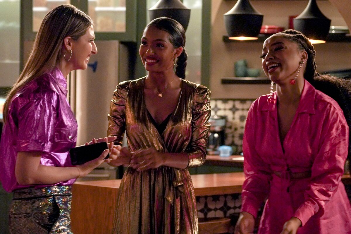 Emily Arlook, left, Yara Shahidi and Chloe Bailey share a laugh in a scene from "Grown-ish" on Freeform.