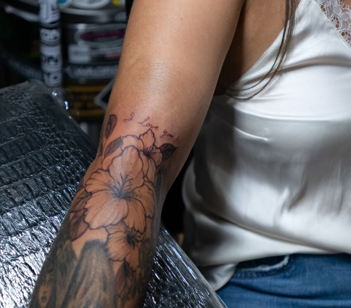 A close-up view of the memorial tattoo on Sazalea Martinez's arm.