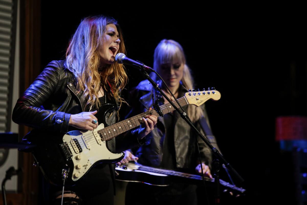 Larkin Poe — sisters Rebecca, left, and Megan Lovell — open for Elvis Costello at the ACE Hotel. They later joined him for his encore.