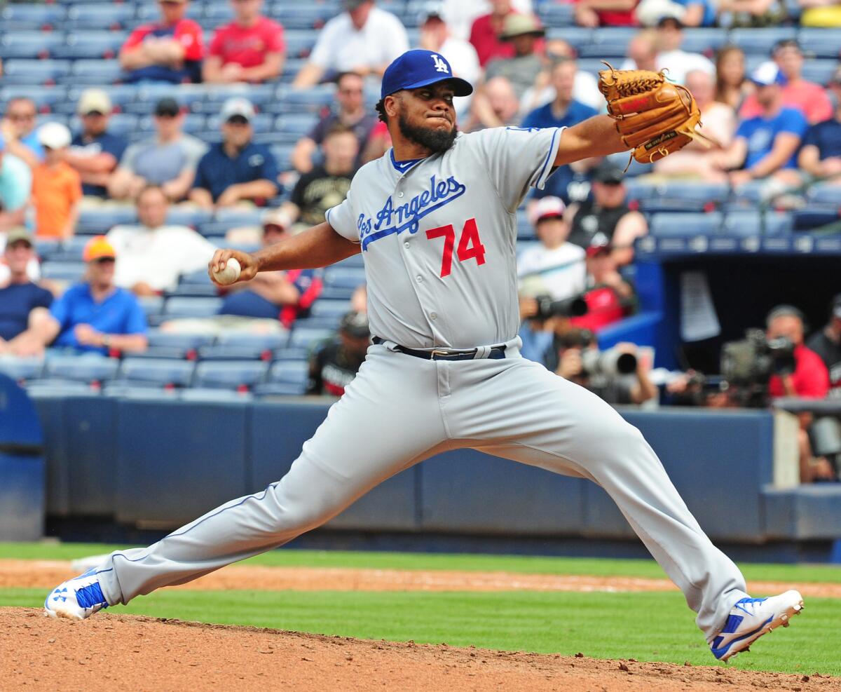 Kenley Jansen of the Los Angeles Dodgers pitches during a game in Atlanta. Rep. Janice Hahn is prodding Time Warner Cable and AT&T, which owns DirecTV, to try to hammer out a distribution deal for SportsNet LA, the TV channel owned by the Dodgers.