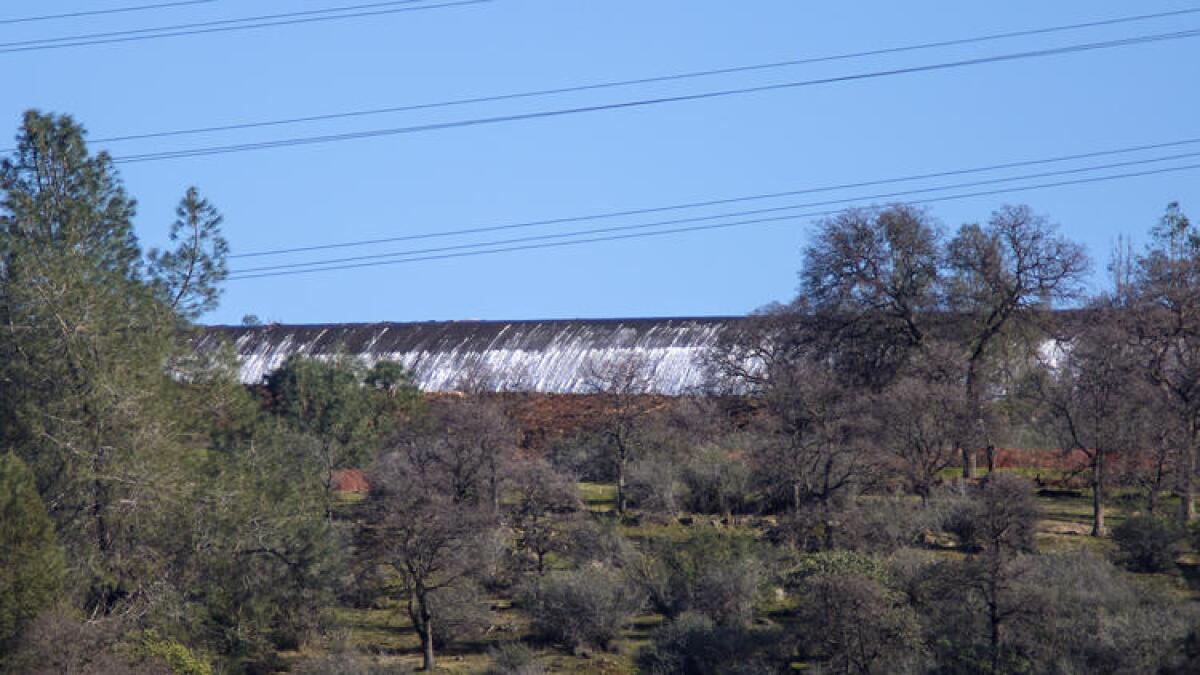 Water flows into the emergency spillway at Lake Oroville