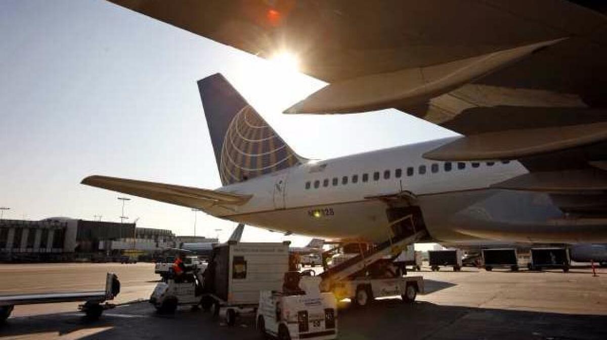 A United Airlines plane sits at a gate at Los Angeles International Airport in 2011. The airline reported strong revenue growth in the three months before a passenger was dragged from the plane in Chicago.