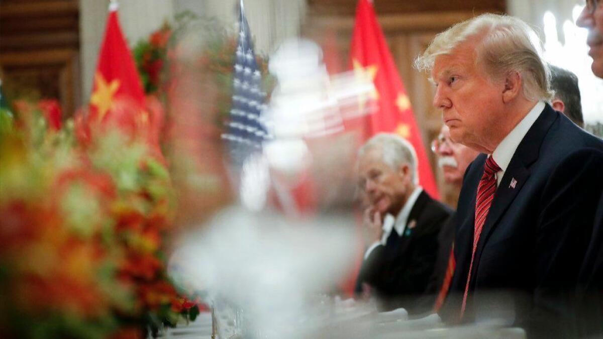 President Trump listens to Chinese President Xi Jinping's speech during their bilateral meeting at the Group of 20 summit in Buenos Aires in December 2018. The two will meet again in Osaka, Japan, this week.
