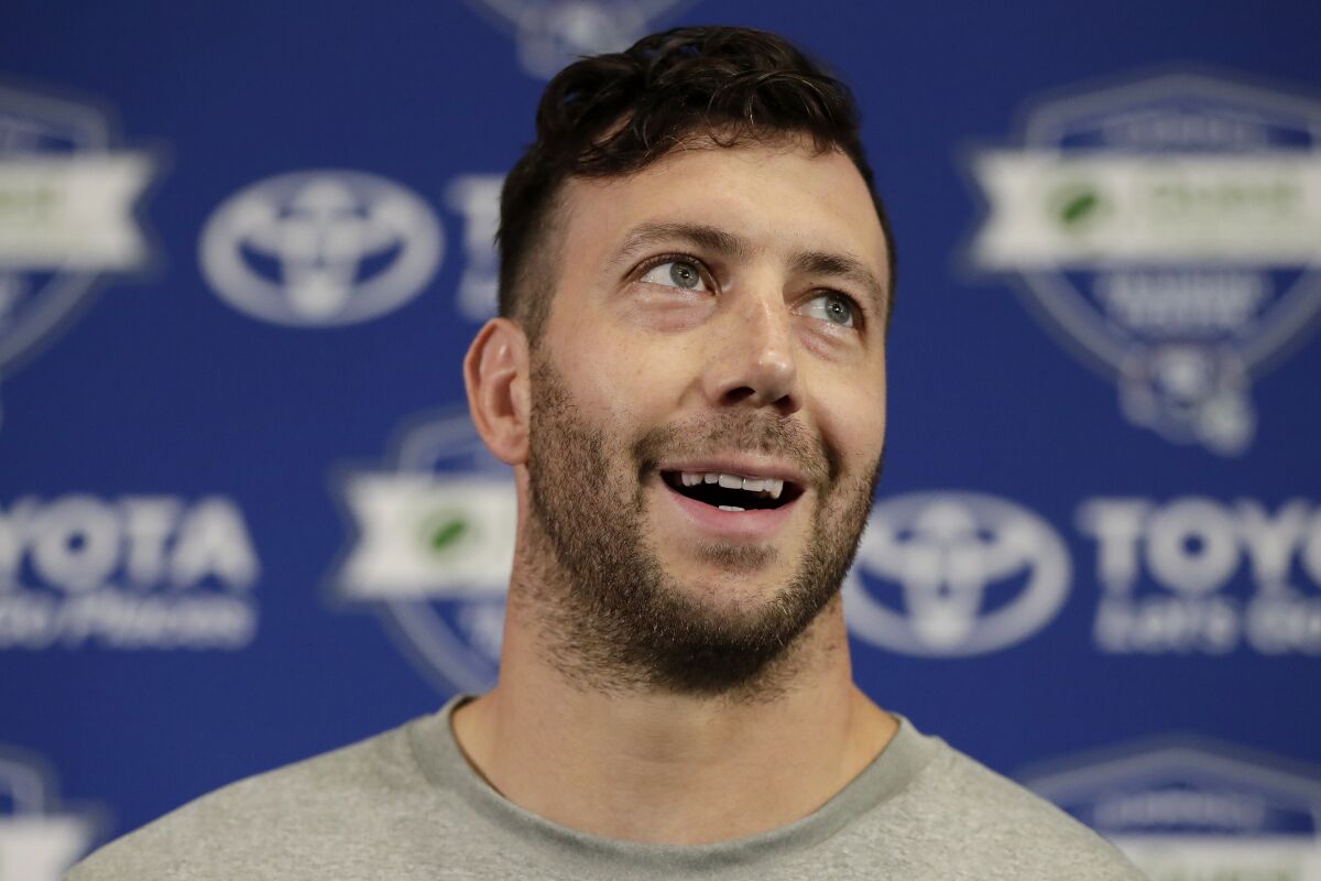 FILE - New York Giants linebacker Connor Barwin speaks to reporters during NFL football training camp, on July 26, 2018, in East Rutherford, N.J. Europe’s soccer leagues are so full of teams owned and operated by American investors that the market could soon be saturated. That’s why a group of six accomplished professionals studying in the executive MBA program at the University of Pennsylvania’s Wharton School turned their attention to basketball and have acquired a 90% stake in the Italian team Pallacanestro Trieste. Former NFL linebacker Connor Barwin is one member of the ownership team. (AP Photo/Julio Cortez, File)