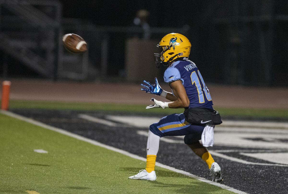 Marina's Luke Lastra catches a pass for a touchdown during a nonleague game against Fountain Valley on Sept. 10.