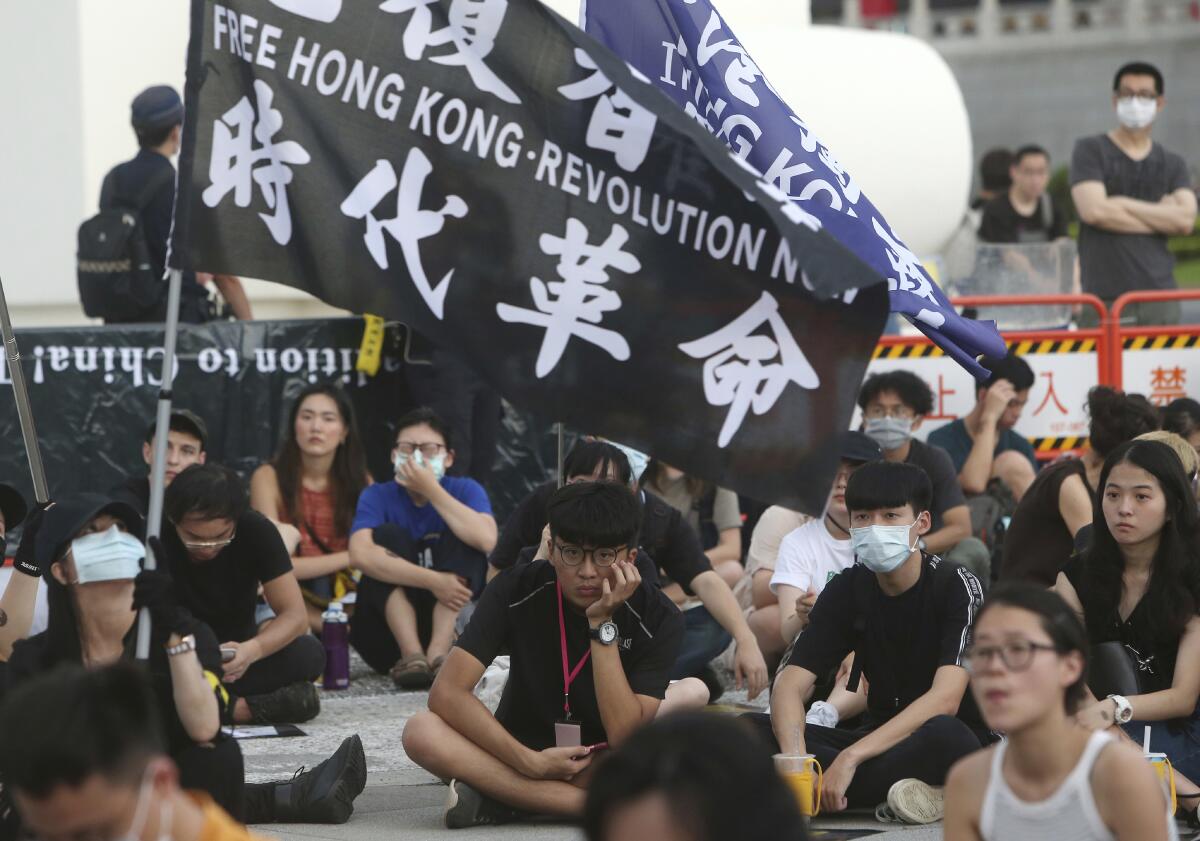 Hong Kong protesters in Taiwan and Taiwanese supporters gathered Saturday to mark the first anniversary of a mass rally.