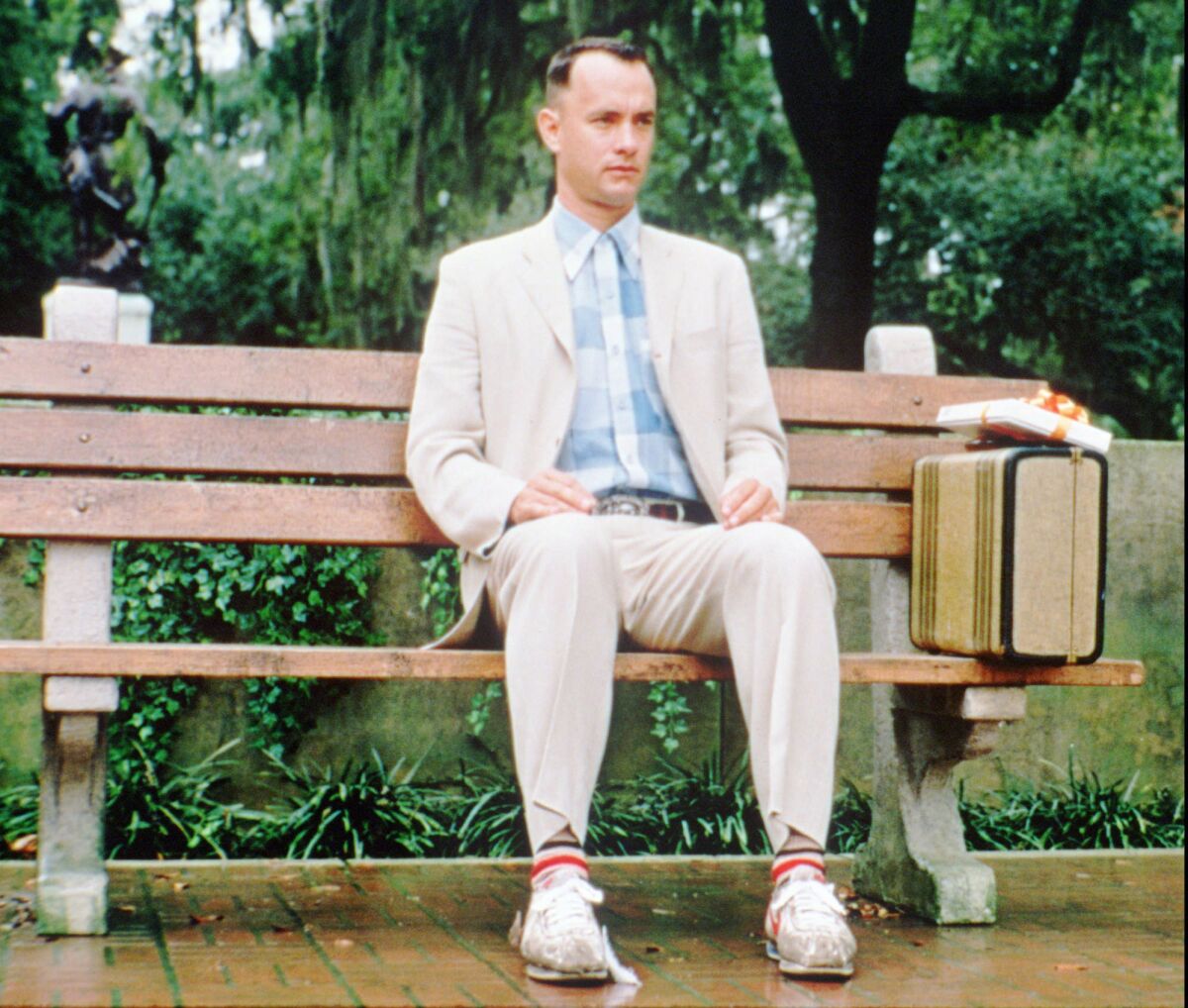  Tom Hanks sitting on a bench in "Forrest Gump"