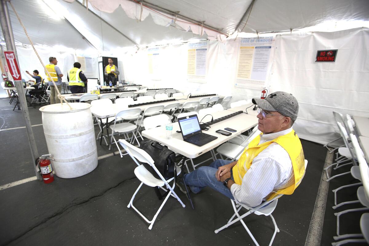 Don Hall, PG&E customer experience manager, deals with a power shutoff in Grass Valley