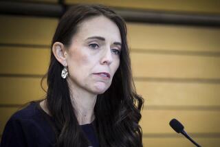 New Zealand Prime Minister Jacinda Ardern grimaces as she announces her resignation at a press conference in Napier, New Zealand Thursday, Jan. 19, 2023. Fighting back tears, Ardern told reporters that Feb. 7 will be her last day in office. (Warren Buckland/New Zealand Herald via AP)