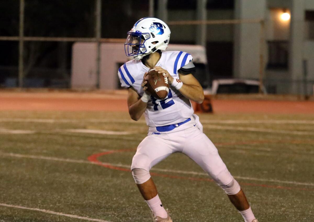 Burbank High's quarterback Aram "Rambo" Araradian drops back to pass during Burbank High School's varsity football team against Crescenta Valley High School's varsity football team in a Pacific League game at Glendale High School in Glendale, Ca., Friday, October 4, 2019. (photo by James Carbone)