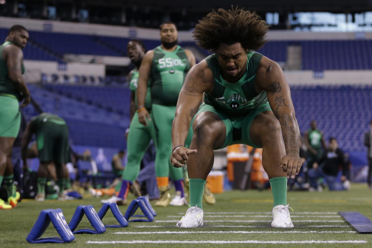 Former USC defensive lineman Leonard Williams runs a drill at the NFL scouting combine in Indianapolis, on Feb. 22.