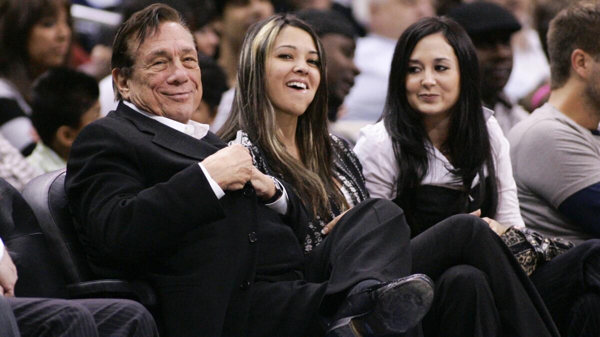 Clippers owner Donald Sterling smiles while sitting courtside during a game against the San Antonio Spurs in 2009 at Staples Center.