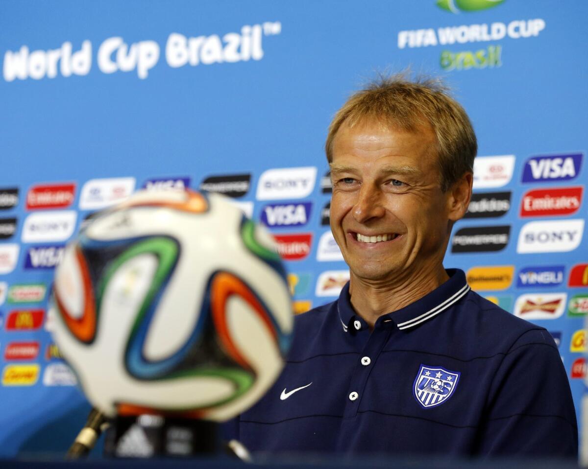 U.S. Coach Juergen Klinsmann smiles during a press conference Sunday at the Estadio Arena das Dunas in Natal, Brazil.