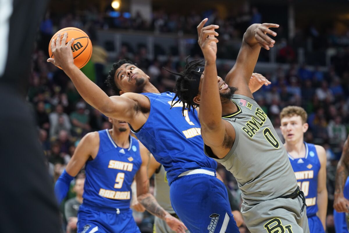 UC Santa Barbara forward Andre Kelly goes up for a basket as Baylor forward Flo Thamba defends.