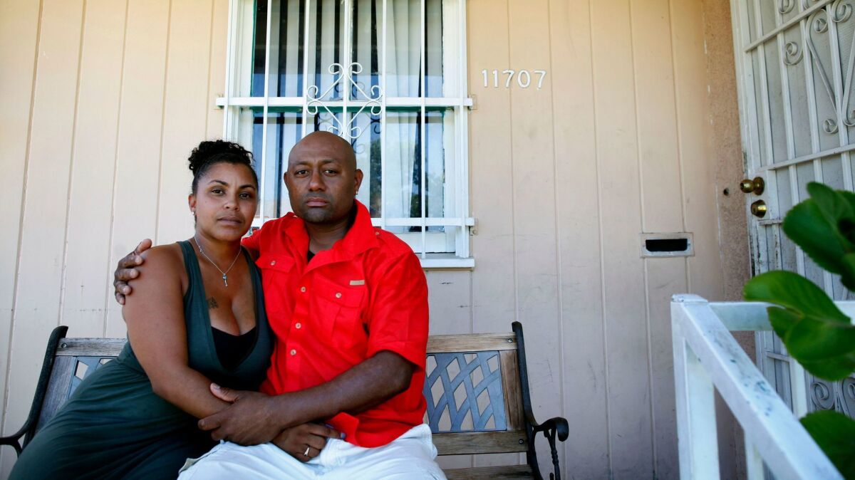 Tyesha Hansborough and her husband, Christley Paton, pictured in 2014, said a mix-up by mortgage servicing firm Ocwen caused them to lose their homeowners insurance. Ocwen has been hit with complaints from consumers and regulators over sloppy practices.