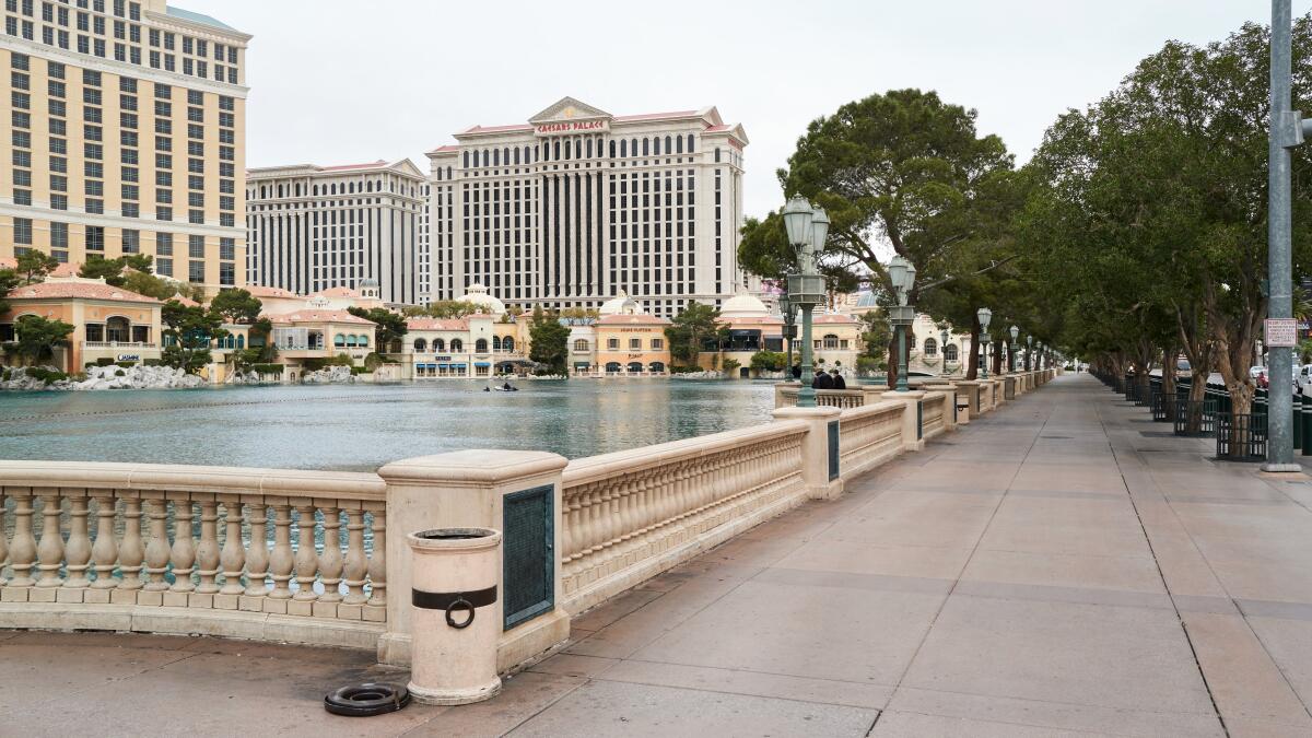 With the Bellagio fountains switched off, the sidewalk in front of the man-made lake was empty March 19. The fountains closed three days earlier.