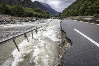The highway A13 between Lostallo and Soazza is seen destroyed by the force of the Moesa river, caused by heavy rain in the Misox valley, in Lostallo, southern Switzerland, Sunday, June 23, 2024. Authorities in Switzerland say rescuers have found the body of one of three people who had gone missing on Saturday after massive thunderstorms and rainfall in the southeast of the county caused a rockslide. (Michael Buholzer/Keystone via AP)