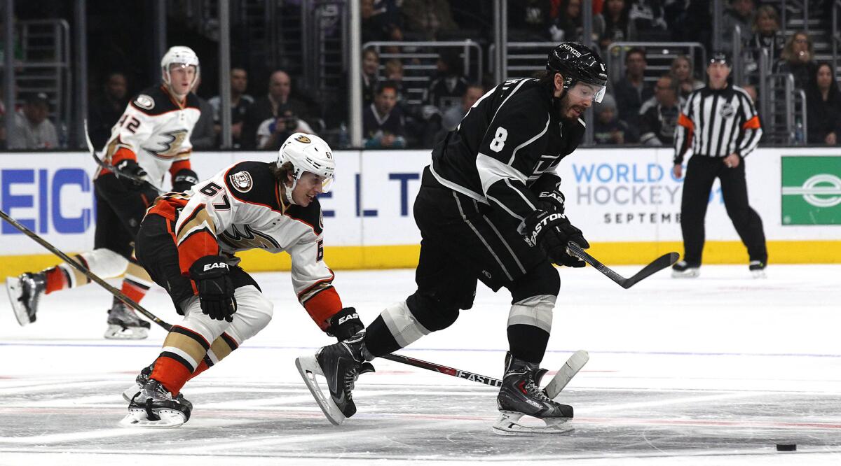Kings defenseman Drew Doughty fights for control of the puck against Ducks forward Rickard Rakell during the second period of a game on March 5 at Staples Center.