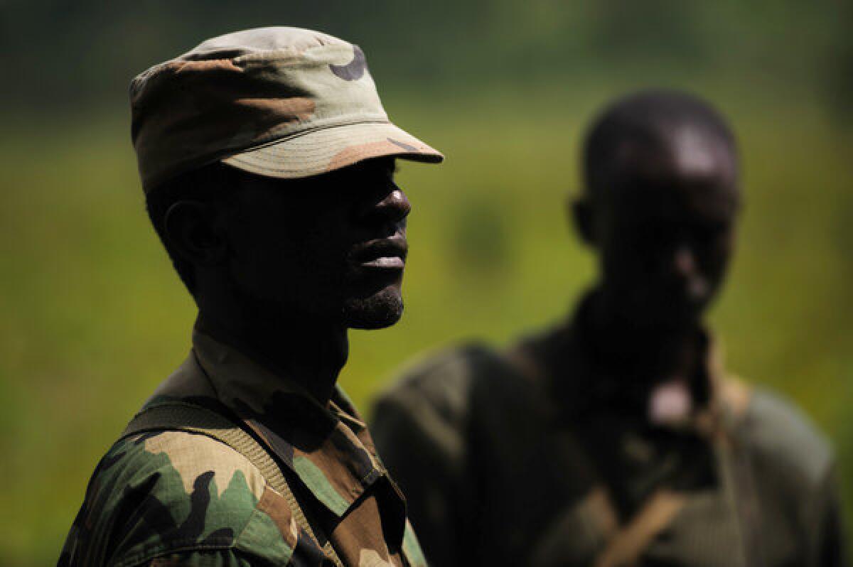 M23 rebels stand at a forward position in the hills of Kanyarucinya on the outskirts of Goma in the eastern Democratic Republic of the Congo on Monday.