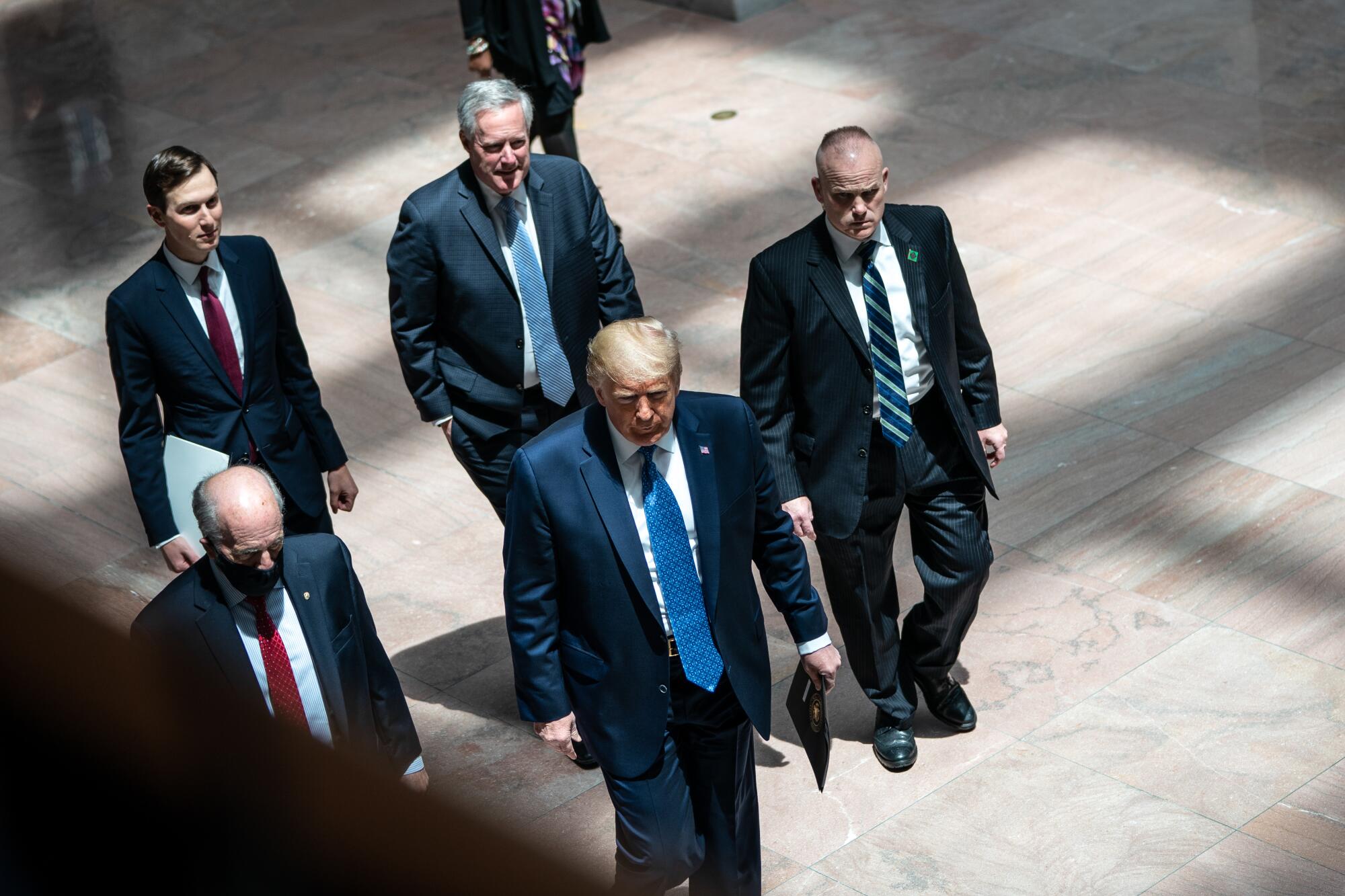  Then-President Trump arrives for a meeting with GOP senators.