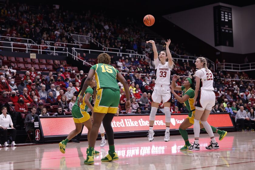 Stanford guard Hannah Jump (33) shoots a 3-point basket during the second half of an NCAA college basketball game against Oregon center Phillipina Kyei (15), Sunday, Jan. 29, 2023, in Stanford, Calif. (AP Photo/Josie Lepe)