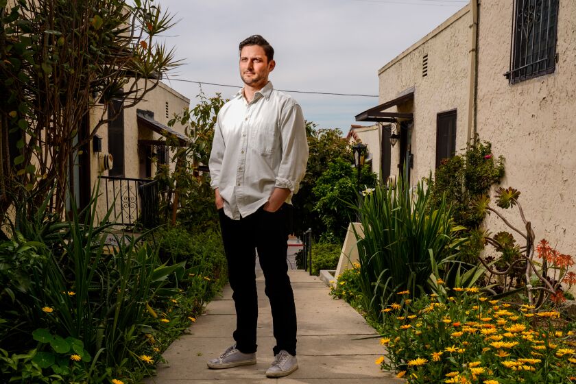 LOS ANGELES, CA - MARCH 31: Actor Josh Schell poses for a portrait outside of his apartment in East Hollywood on Tuesday, March 31, 2020 in Los Angeles, CA. Like many others in the entertainment industry, Schell, is out of work with few options due to the shutdown caused by the coronavirus pandemic. (Kent Nishimura / Los Angeles Times)