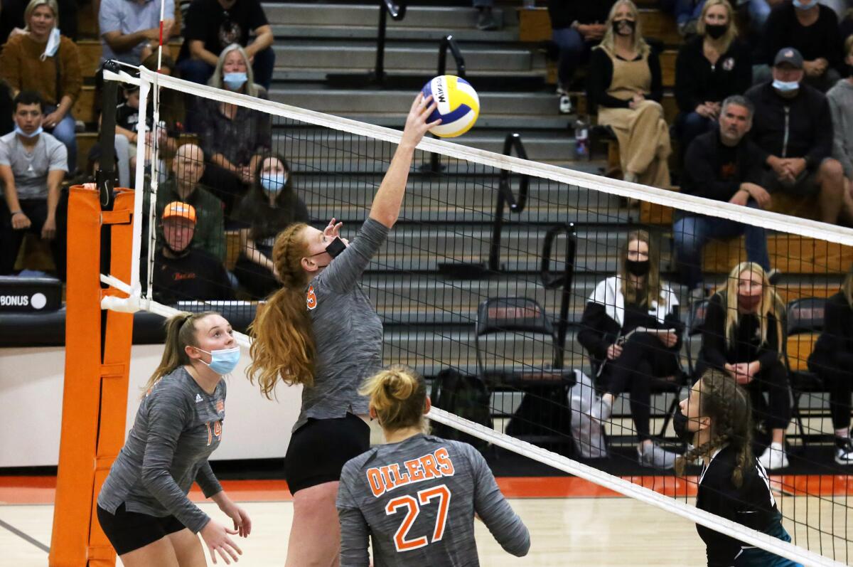 Huntington Beach's Sydney Murray (7) taps the ball over the net during the CIF Southern Section Division 2 final.