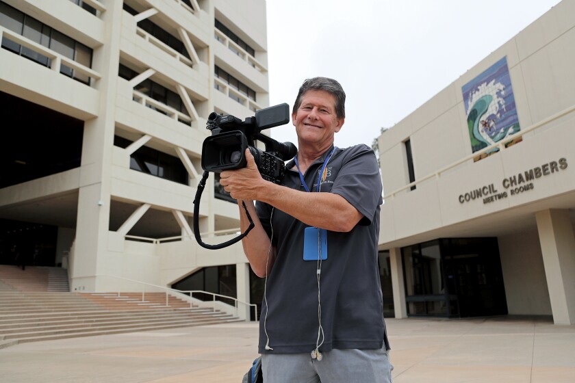 Videographer Matt Liffreing, 59, poses for a portrait at Huntington Beach City Hall on Wednesday.