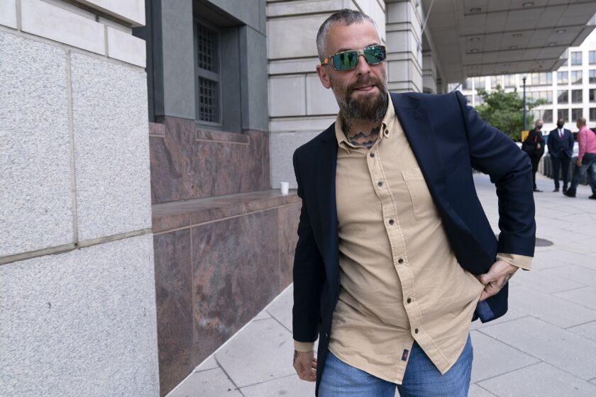 Former D.C. Metropolitan Police Officer Michael Fanone leaves the federal courthouse after Kyle Young, who assaulted Fanone during the Jan. 6 riots, was sentenced to more than seven years in prison after a trial in Washington, Tuesday, Sept. 27, 2022. (AP Photo/Jose Luis Magana)
